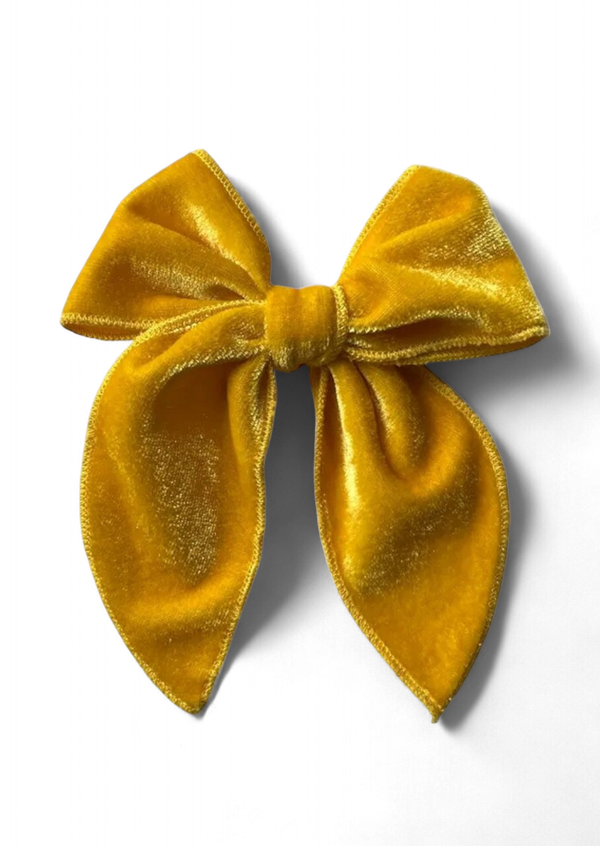 Hand tied bow in gold velvet